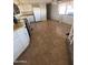Kitchen with tile floor and white appliances at 3104 E Broadway Rd # 295, Mesa, AZ 85204