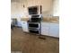 Kitchen featuring stainless steel stove and white cabinets at 3104 E Broadway Rd # 295, Mesa, AZ 85204