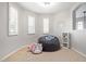 Spare bedroom with carpet flooring, two windows, and featuring a modern beanbag and some stuffed animals at 3190 S Holguin Way, Chandler, AZ 85248