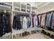 This large walk-in closet has ample storage space with clothing racks, shelves, and shoe racks at 3190 S Holguin Way, Chandler, AZ 85248