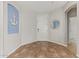 Beautiful foyer with neutral paint and tile, custom millwork, and a white front door at 3190 S Holguin Way, Chandler, AZ 85248
