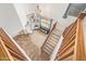 Foyer featuring high ceilings, decorative chandelier, tile flooring, and wooden staircase at 3190 S Holguin Way, Chandler, AZ 85248