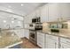 Stylish kitchen featuring white cabinets, stainless steel appliances, and granite countertops with tiled backsplash at 3190 S Holguin Way, Chandler, AZ 85248