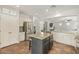 Bright kitchen with a central island, stainless steel appliances, and seamless flow to the living spaces at 3190 S Holguin Way, Chandler, AZ 85248