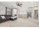 Upstairs living room featuring carpet flooring, a gray sectional sofa, and an alcove with a beanbag at 3190 S Holguin Way, Chandler, AZ 85248
