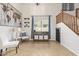 Open living space with soaring ceilings, custom built ins, and decorative stairway at 3190 S Holguin Way, Chandler, AZ 85248