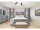 Main bedroom featuring tiled floors, matching dresser and nightstands, and natural light from two windows at 3190 S Holguin Way, Chandler, AZ 85248