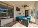 Inviting covered patio with comfortable seating, a ceiling fan, and a TV, perfect for outdoor living at 3190 S Holguin Way, Chandler, AZ 85248