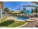 Backyard pool with colorful umbrellas, spa, and low maintenance turf create a backyard oasis at 3190 S Holguin Way, Chandler, AZ 85248