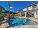 Stunning backyard featuring a sparkling pool, covered patio, and lush artificial turf for relaxation at 3190 S Holguin Way, Chandler, AZ 85248