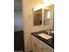 Bathroom with large mirror, granite counter, and modern vanity at 327 E La Jolla Dr, Tempe, AZ 85282