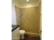 Tiled walk in shower with bench and sleek vanity at 327 E La Jolla Dr, Tempe, AZ 85282