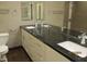 Modern bathroom with dual sinks, granite countertops, and sleek fixtures at 327 E La Jolla Dr, Tempe, AZ 85282