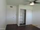 Bright bedroom features a ceiling fan and closet with sliding doors at 327 E La Jolla Dr, Tempe, AZ 85282