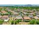 An aerial view shows the layout of the neighborhood with many well maintained houses and landscaping at 3400 S Whetstone Pl, Chandler, AZ 85286