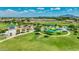 Aerial view of neighborhood park with playground, basketball court, and green spaces at 3400 S Whetstone Pl, Chandler, AZ 85286