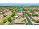 Expansive aerial view showcasing the community, including a lake, green spaces, and surrounding homes at 3400 S Whetstone Pl, Chandler, AZ 85286