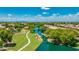 Aerial view of neighborhood with winding waterway, walking paths, and lush landscaping at 3400 S Whetstone Pl, Chandler, AZ 85286