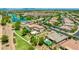 A captivating aerial view showing the community's homes, a beautiful lake, and verdant walking paths at 3400 S Whetstone Pl, Chandler, AZ 85286