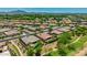 A wide aerial view highlights the neighborhood with well-maintained homes, green spaces, and serene surroundings at 3400 S Whetstone Pl, Chandler, AZ 85286