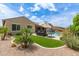 Spacious backyard with a pool, patio furniture, and lush landscaping for outdoor enjoyment at 3400 S Whetstone Pl, Chandler, AZ 85286