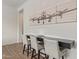 Modern bar area with sleek countertop seating and airplane art at 3400 S Whetstone Pl, Chandler, AZ 85286