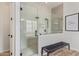 Luxurious bathroom featuring a glass-enclosed shower, a bench, and modern tile finishes at 3400 S Whetstone Pl, Chandler, AZ 85286