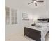 Comfortable bedroom featuring a shuttered window, black bed frame, and decorative accents at 3400 S Whetstone Pl, Chandler, AZ 85286