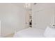 Light-filled bedroom featuring a chandelier, closet with sliding doors, and neutral palette at 3400 S Whetstone Pl, Chandler, AZ 85286