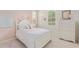 Charming pink bedroom with a white bed frame, shuttered windows, and classic decor at 3400 S Whetstone Pl, Chandler, AZ 85286