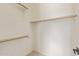 Bright closet with built-in shelves and a wooden clothes rack, offering ample storage space at 3400 S Whetstone Pl, Chandler, AZ 85286