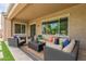 Comfortable covered patio featuring plush outdoor seating and an inviting atmosphere at 3400 S Whetstone Pl, Chandler, AZ 85286