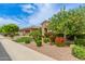 Beautiful home exterior featuring lush landscaping and a well-maintained lawn at 3400 S Whetstone Pl, Chandler, AZ 85286