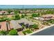 Gorgeous home exterior with a well-kept lawn, mature landscaping, and an inviting stone-accented entryway at 3400 S Whetstone Pl, Chandler, AZ 85286