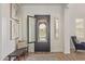 Bright and inviting foyer featuring hardwood floors and stylish decorative front door at 3400 S Whetstone Pl, Chandler, AZ 85286