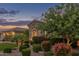 Single-Gathering home featuring manicured landscaping, a stone archway entry, and a well-kept front lawn at 3400 S Whetstone Pl, Chandler, AZ 85286