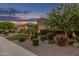 Single-Gathering home featuring manicured landscaping, a stone archway entry, and a well-kept front lawn at 3400 S Whetstone Pl, Chandler, AZ 85286