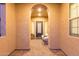 Inviting front porch featuring a decorated front door, textured walls and furniture at 3400 S Whetstone Pl, Chandler, AZ 85286