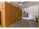 Well-organized garage featuring built-in storage, water heater, and epoxy flooring at 3400 S Whetstone Pl, Chandler, AZ 85286
