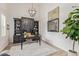 Well-appointed home office with custom built-ins, a large desk, and decorative accents at 3400 S Whetstone Pl, Chandler, AZ 85286