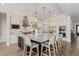 Kitchen island features granite countertops, barstool seating, and stainless steel appliances at 3400 S Whetstone Pl, Chandler, AZ 85286