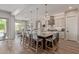Spacious kitchen with a large island, barstool seating, pendant lights, and open floor plan at 3400 S Whetstone Pl, Chandler, AZ 85286