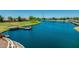 Picturesque lake with a wooden pier, perfect for relaxing by the water, enjoying the views, and fishing at 3400 S Whetstone Pl, Chandler, AZ 85286