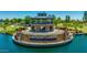 Layton Lakes' sign is on an island surrounded by water and featuring a gazebo-like structure in a picturesque lakeside setting at 3400 S Whetstone Pl, Chandler, AZ 85286