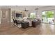 Cozy living room with built-ins, tile floors, and a view of the pool at 3400 S Whetstone Pl, Chandler, AZ 85286
