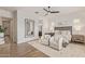 Spacious main bedroom showcasing hardwood floors, and a cozy seating area with stylish decor at 3400 S Whetstone Pl, Chandler, AZ 85286