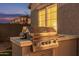Outdoor kitchen area featuring a stainless steel grill, ideal for outdoor cooking at 3400 S Whetstone Pl, Chandler, AZ 85286