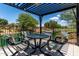 Cozy outdoor patio with pergola and seating area overlooks a tranquil waterway at 3400 S Whetstone Pl, Chandler, AZ 85286
