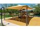 Covered playground with climbing structures, slides, and shade, offering a safe and enjoyable play area for  at 3400 S Whetstone Pl, Chandler, AZ 85286