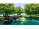 A tranquil pond is the focal point, enhanced by a charming stone bridge and lush greenery at 3400 S Whetstone Pl, Chandler, AZ 85286
